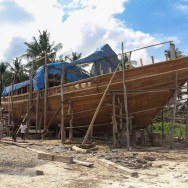 Stuart's 30 meter long boat, with Stuart and some workers in the bottom left