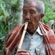 Old man playing flute, Sulawesi